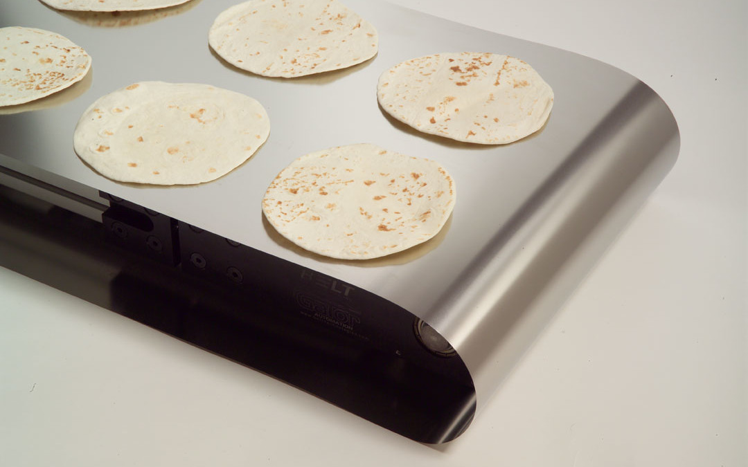 Engineering Perforated Metal Conveyor Belts for Automated Frozen Pizza Production